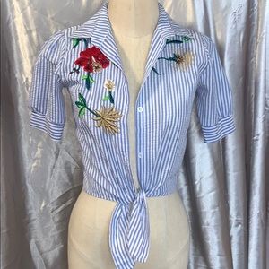 Shirt with floral embellishment